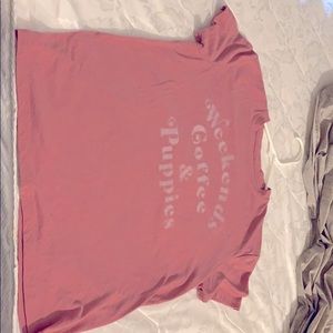 Pink shirt says (weekend Coffee &puppies)